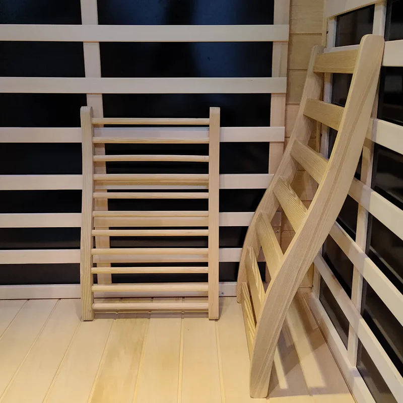 Wooden ladder against a black and white striped wall