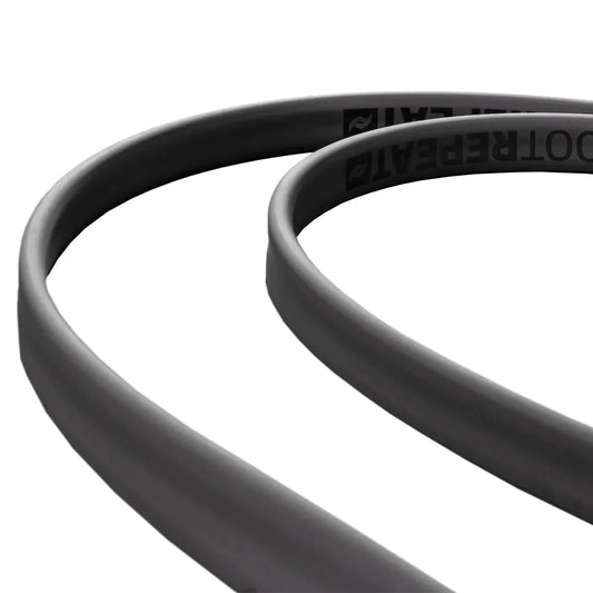 Close-up of 2 black cables on a white background