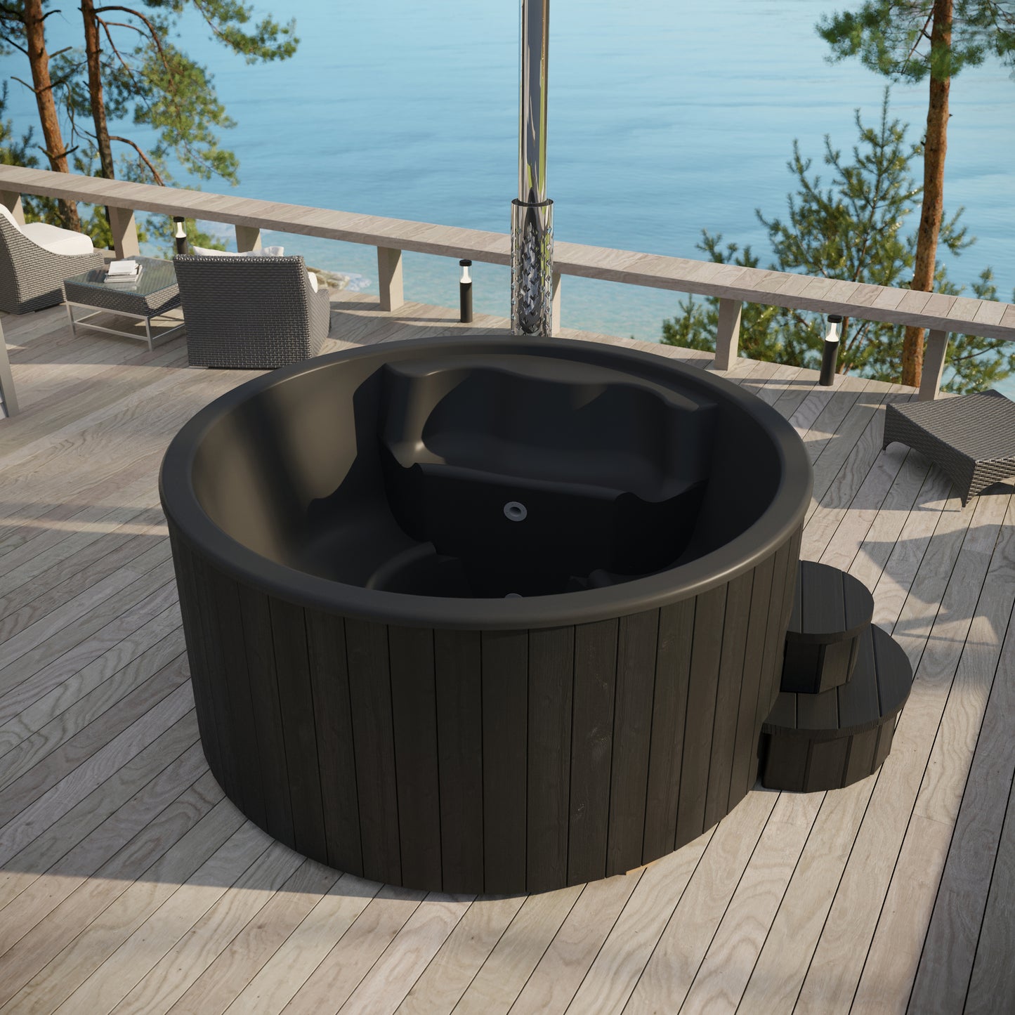 Black outdoor hot tub on a wooden deck with a scenic view of water and trees.
