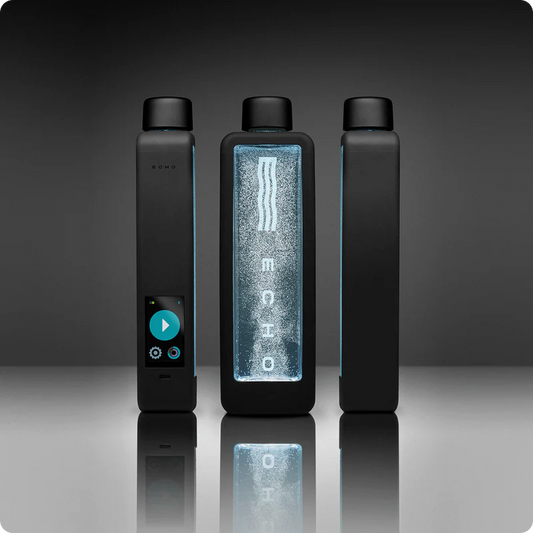 Three sides of water bottle with digital display on a reflective surface and dark background