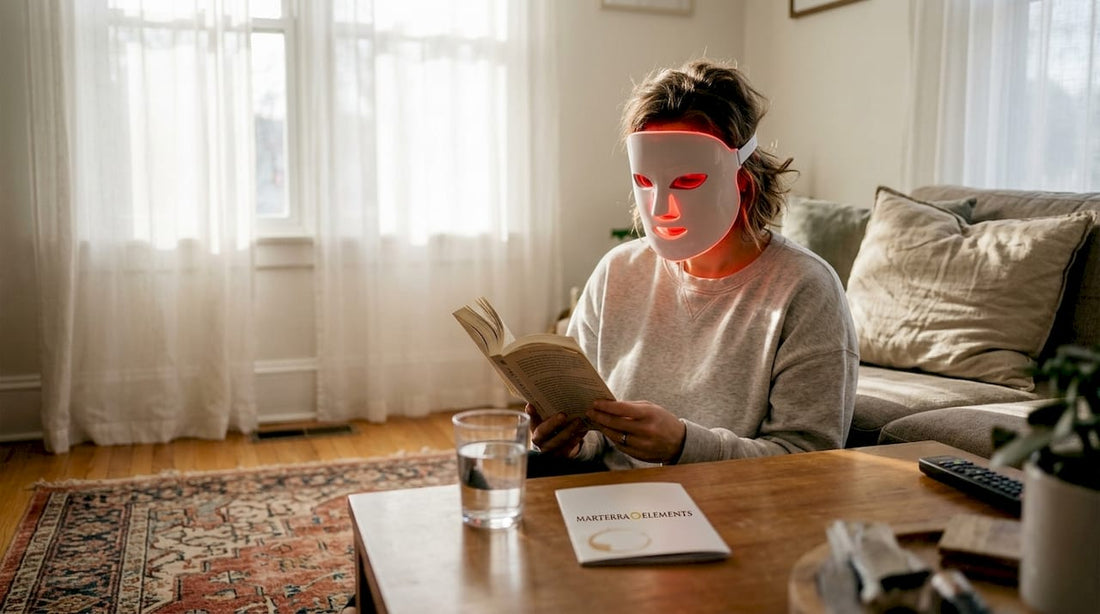 Woman using facial red light mask at home