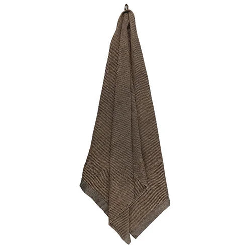 Brown textured towel hanging on a white background