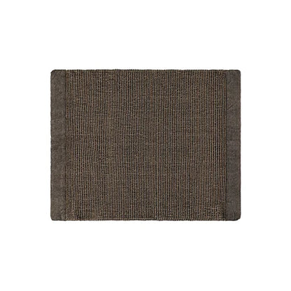 A rectangular woven placemat with a textured, ribbed surface and solid borders, shown flat against a plain white background.
