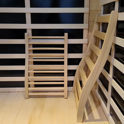 Wooden ladder against a black and white striped wall