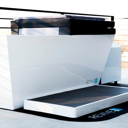 White and black device labeled 'REVIVE' on a white background