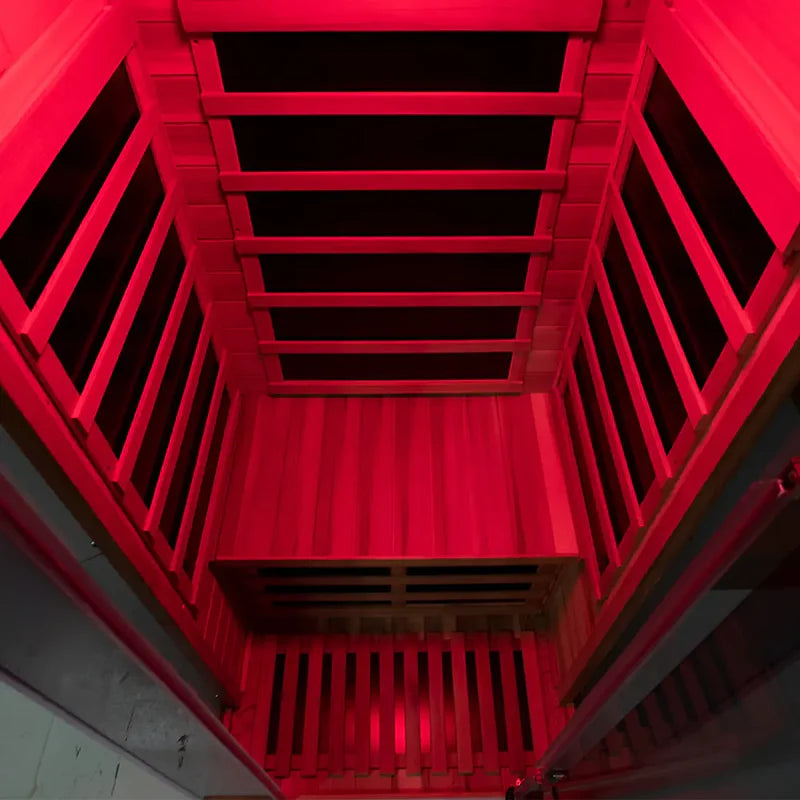 Red metal staircase with a black railing inside a building