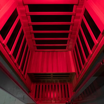 Red metal staircase with a black railing inside a building