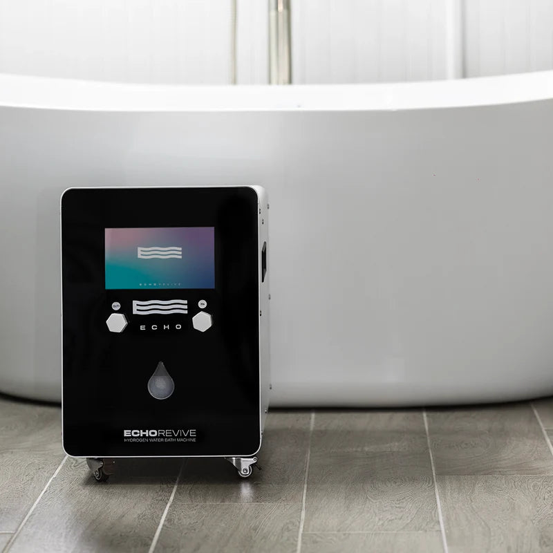 Black hydrogen generator labeled 'Echo Revive' on a tiled floor with a bathtub in the background.