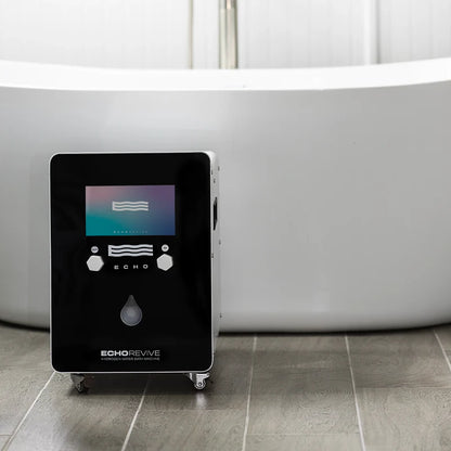 Black hydrogen generator labeled 'Echo Revive' on a tiled floor with a bathtub in the background.