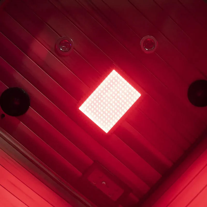 Red light therapy panel on a wooden floor
