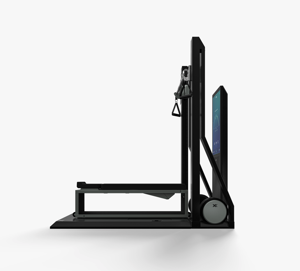 Black mechanical device with a tablet attached on a white background