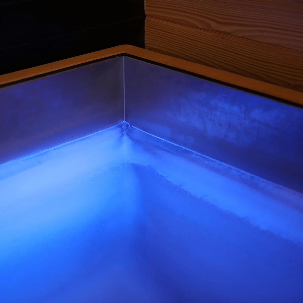 Corner of a pool with blue lighting