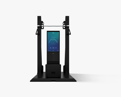 Black machine with a digital display on a white background