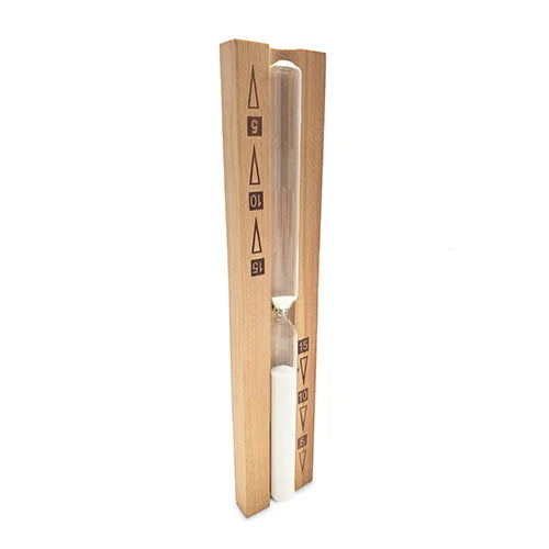 A wooden hourglass timer with a clear glass hourglass filled with white sand, set between two light wood blocks with black countdown markings.