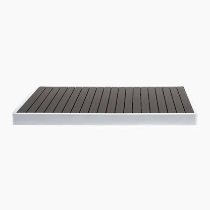 Rectangular wooden deck board with a white base on a white background