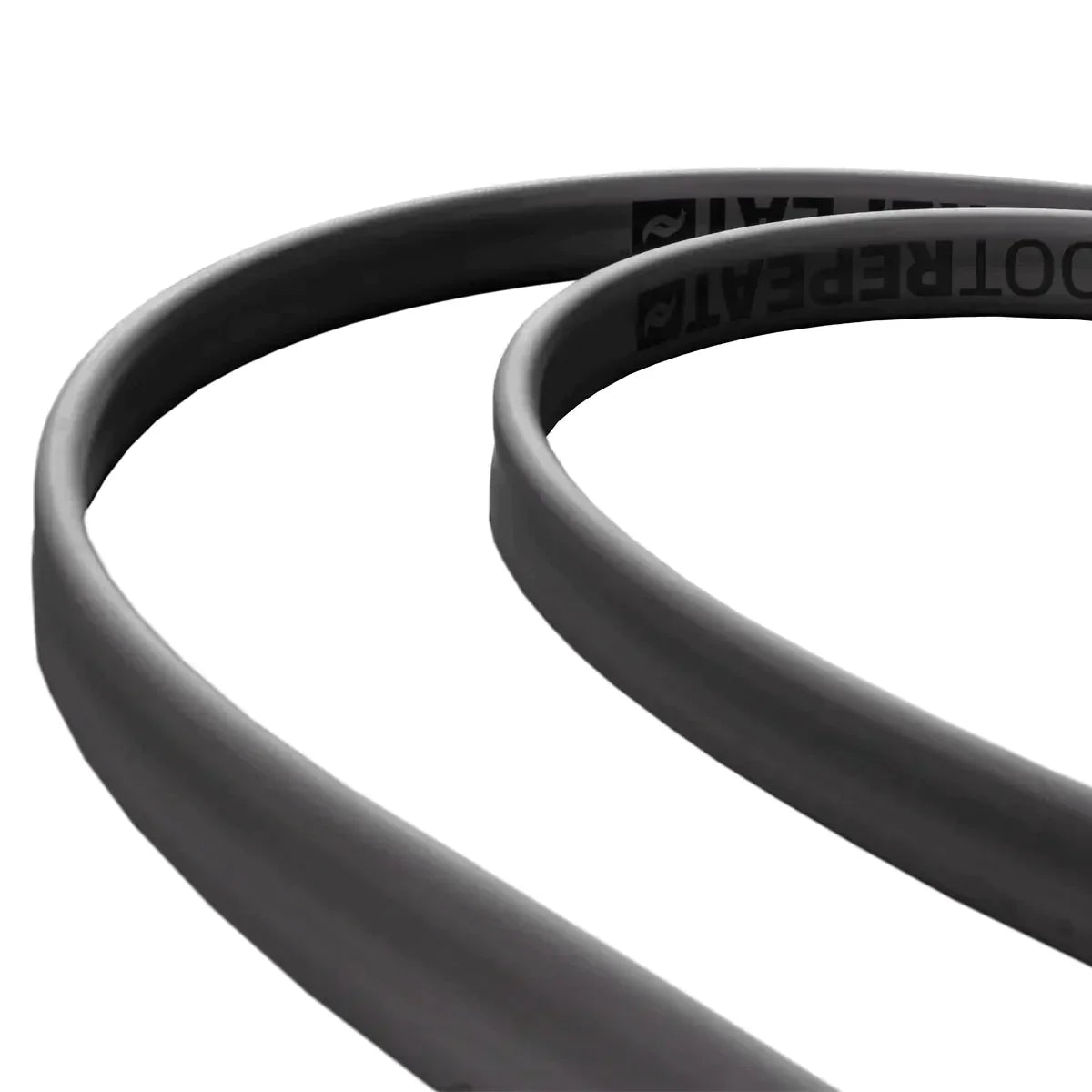 Close-up of a black cable on a white background