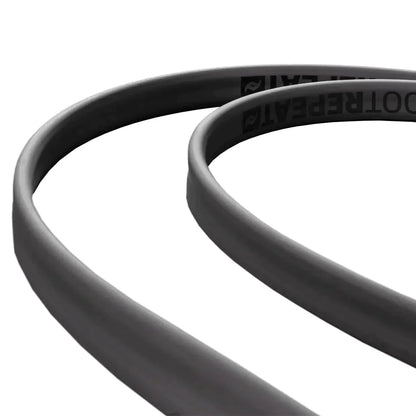Close-up of a black cable on a white background