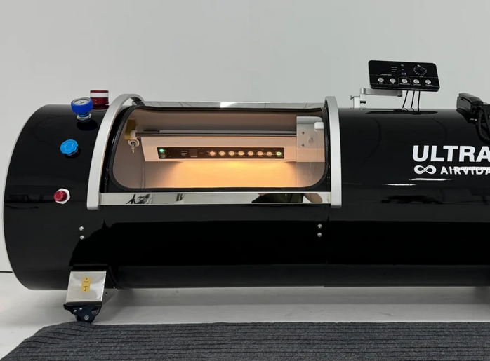 Black airvida hyperbaric chamber on white background