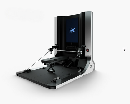 Black and silver exercise machine with a screen displaying 'X' on a white background