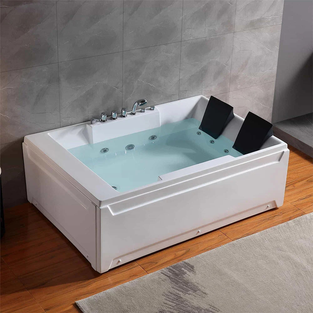 White Jacuzzi bathtub with water in a bathroom setting