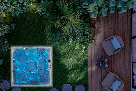 Top-down view of a hot tub in a garden with plants and outdoor furniture.