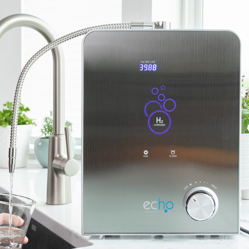 Hydrogen water generator with digital display and 'echo' branding in a kitchen setting.