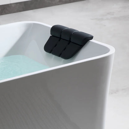 Black bathtub support device on a white bathtub with water.