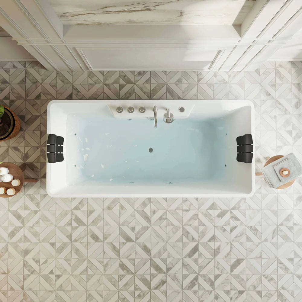 White freestanding bathtub in a bathroom with geometric tile flooring