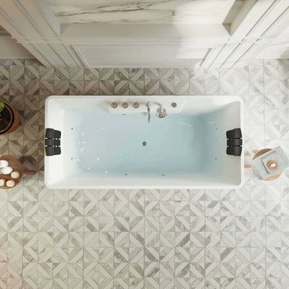 White freestanding bathtub in a bathroom with geometric tile flooring