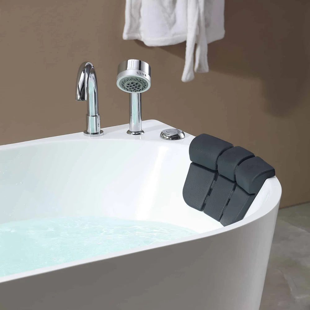 Bath tub with faucet and shower head, black bath pillow on edge