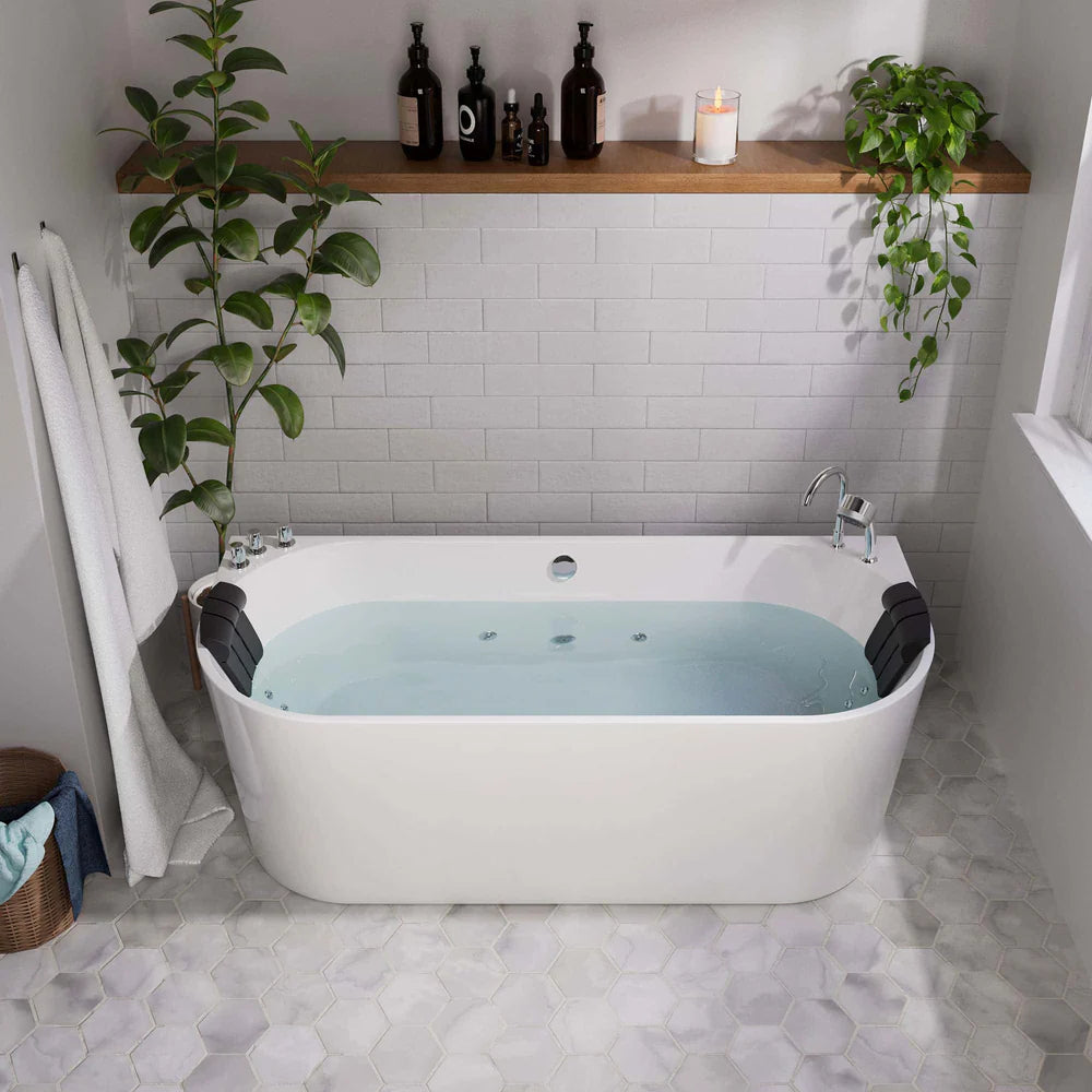 Modern bathroom with a freestanding bathtub filled with water, surrounded by plants and shelves.