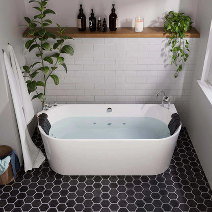Bathroom with a white bathtub, black tiled floor, and a wooden shelf with bottles and plants.