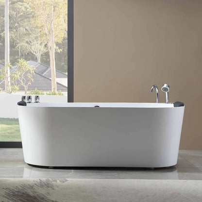 White freestanding bathtub in a modern bathroom with a view of trees outside.