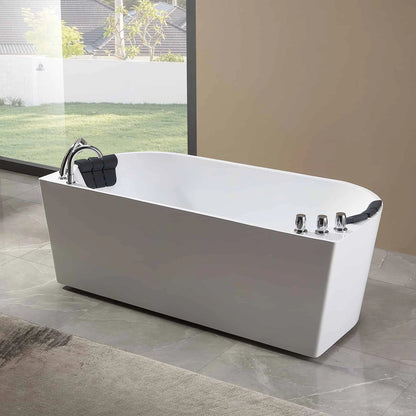 White freestanding bathtub in a modern bathroom with large windows.