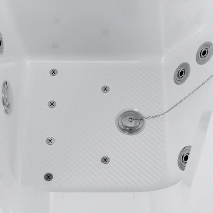 Close-up of a white hot tub with multiple jets and a chain.