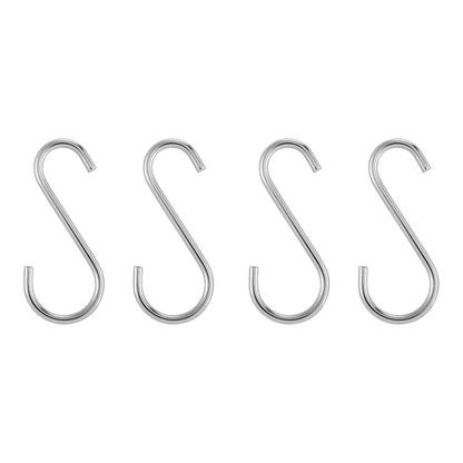 Four metal S-hooks on a white background