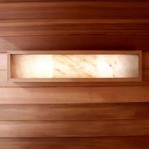 Himalayan salt with a light fixture embedded in a wooden panel.