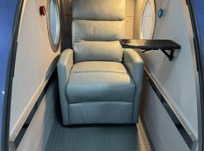 Interior of  Hyperbaric Chamber ith a chair and a table
