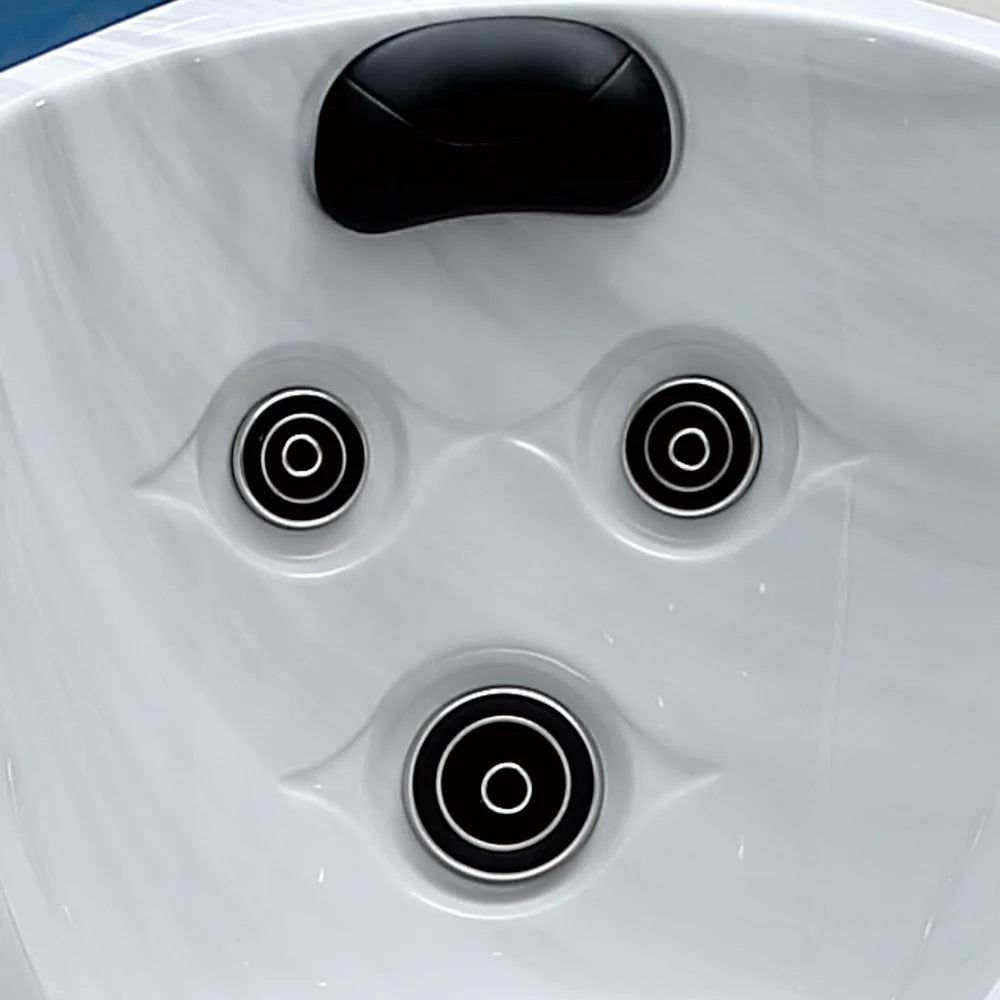 Close-up of a hot tub with three circular jets.
