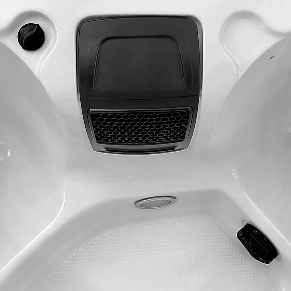 Close-up of a hot tub in a white interior setting