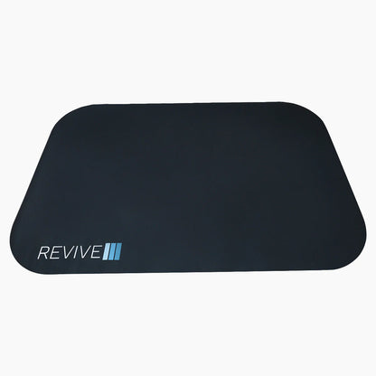 Black mat with 'REVIVE' branding on a white background