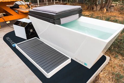 cold tub with control panel on a mat outdoors