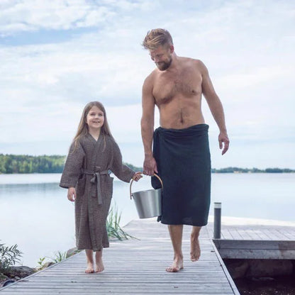 Man and child walking by the lake