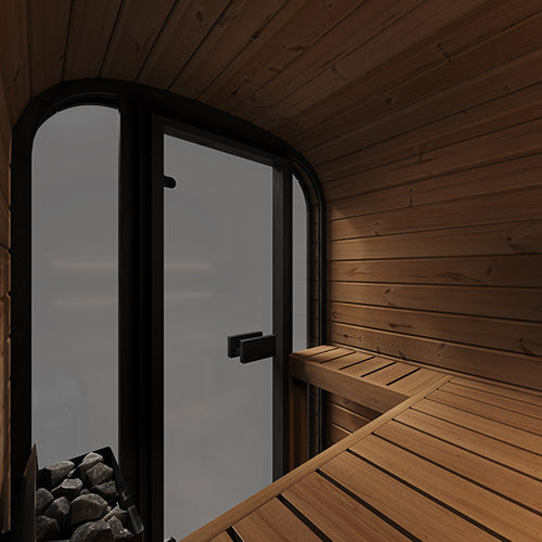 Wooden sauna interior with a glass door