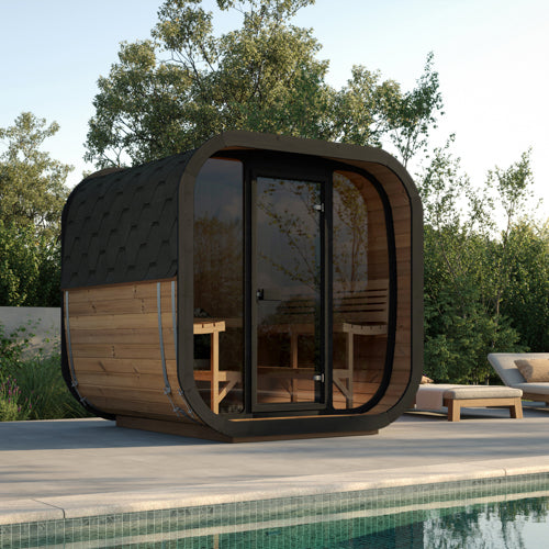 Modern outdoor sauna with wooden exterior and glass doors, set against a natural backdrop.