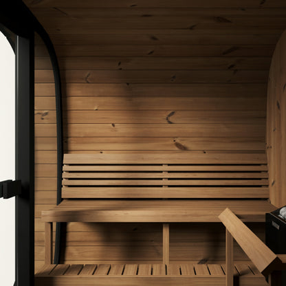 Wooden sauna interior with benches and a door.