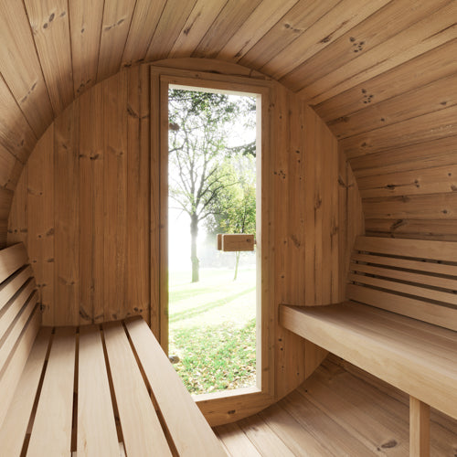 Wooden sauna with a door open to a garden view