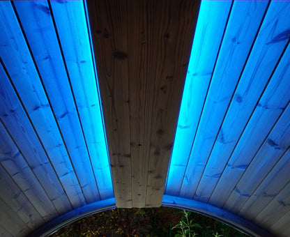 Wooden ceiling with blue LED lights on a circular structure.