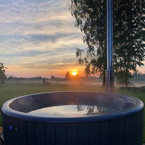 Hot tub on a sunset background