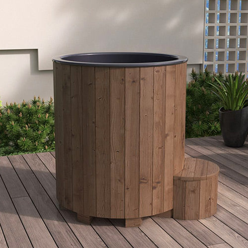 Wooden tub with black interior on a wooden deck